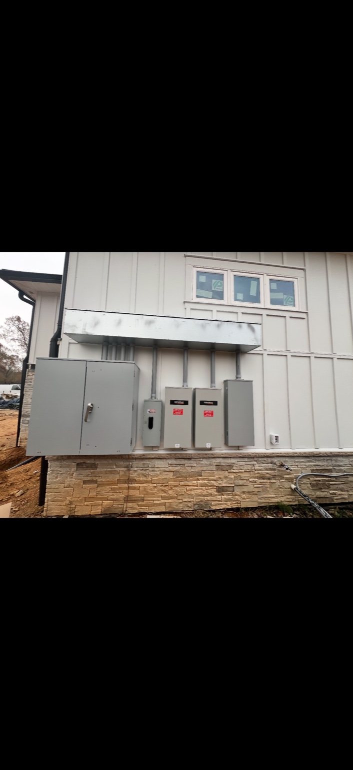 Multiple exterior electrical panels neatly piped (Solar disconnects)