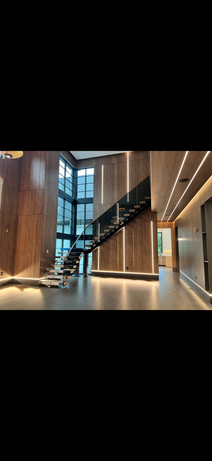 Floating staircase with wall lighting