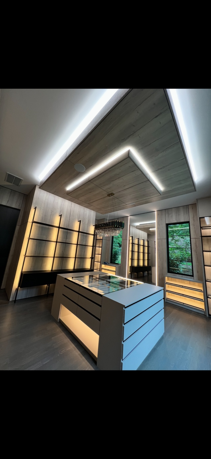 Custom closet with lit shelving